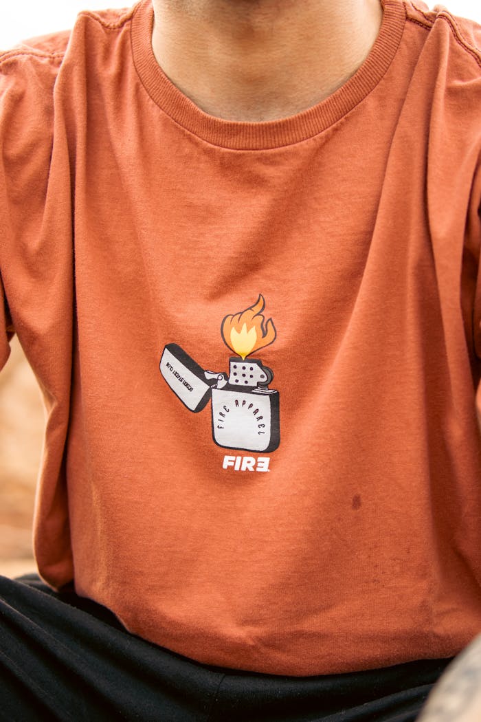 About A casual fashion t-shirt featuring a flame graphic and lighter design.